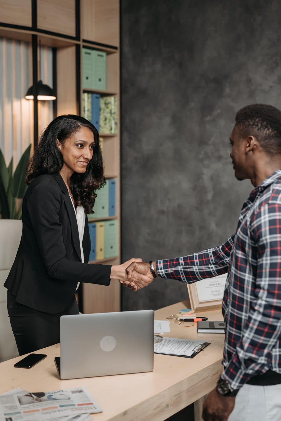 A successful placement — employer and candidate shaking hands